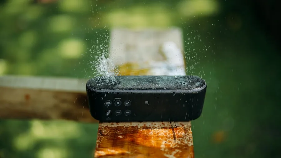 Person testing waterproof speaker durability outdoors in natural water environment