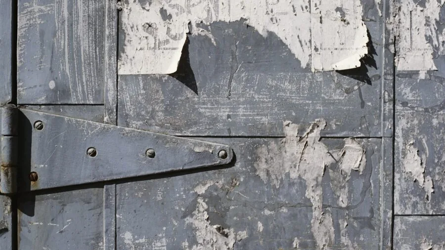Person unlocking modern home entrance door with secure lock system