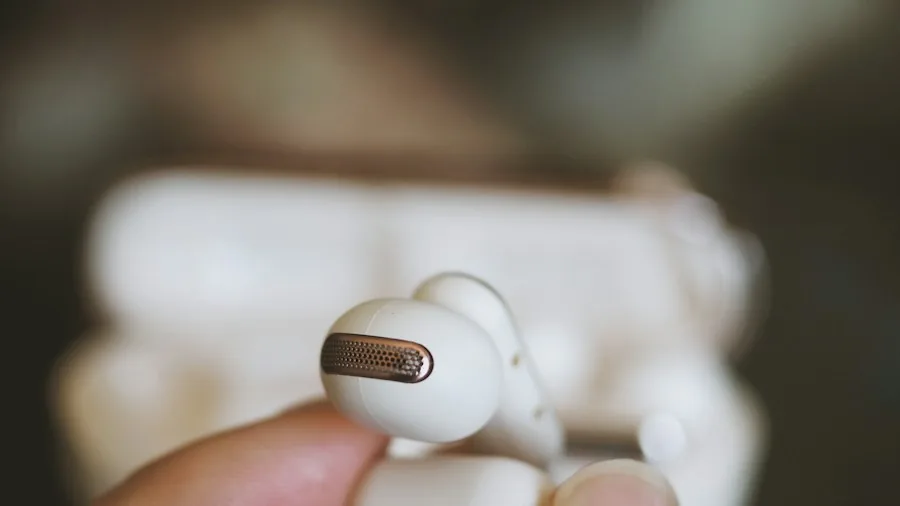 person using earbuds gaming console