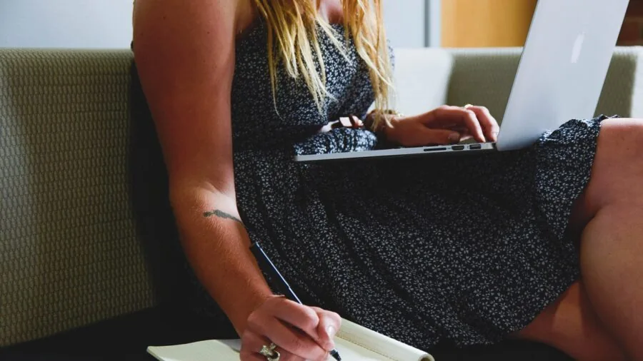 Person using laptop for file management and data transfer work