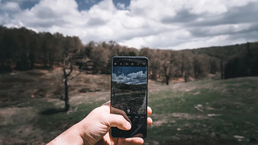 person using phone features outdoors