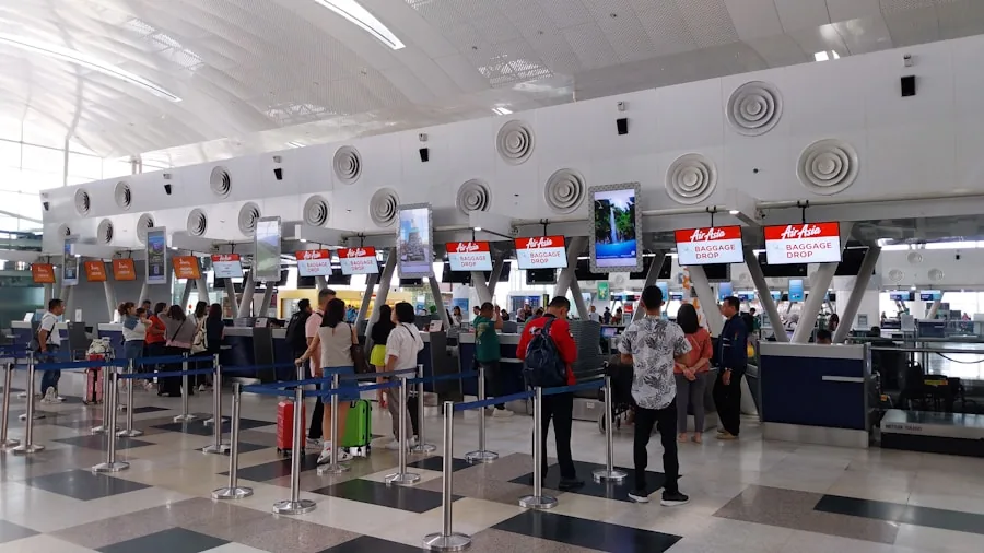 person using phone for translation at airport counter
