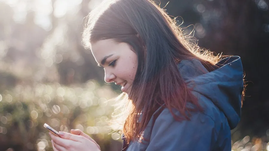 person using smartphone all day outdoors