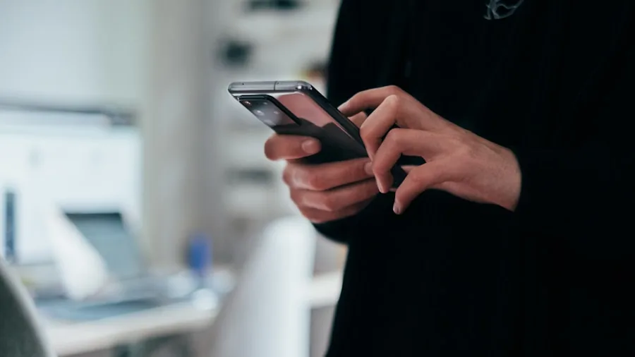 person using smartphone controls