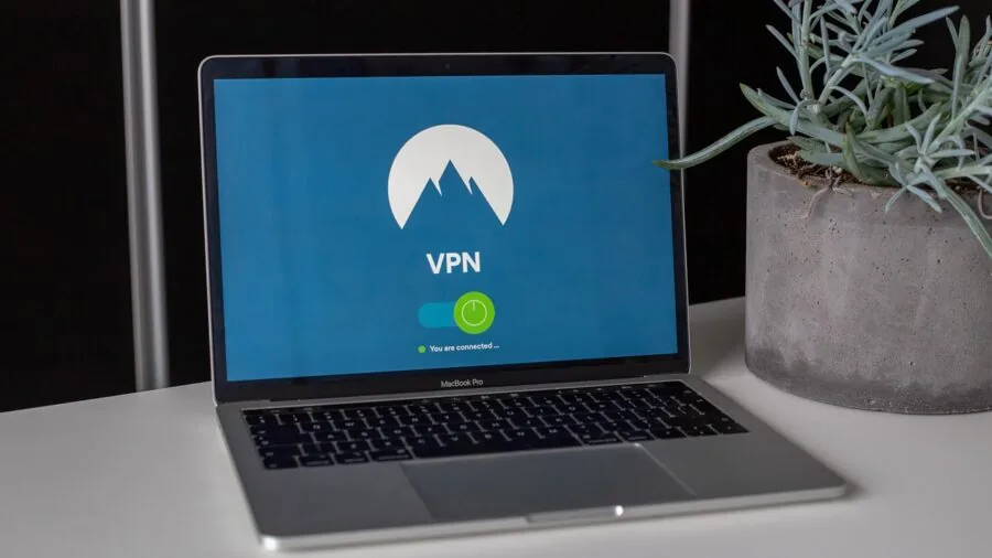 Person using tablet connected to wireless network in home environment