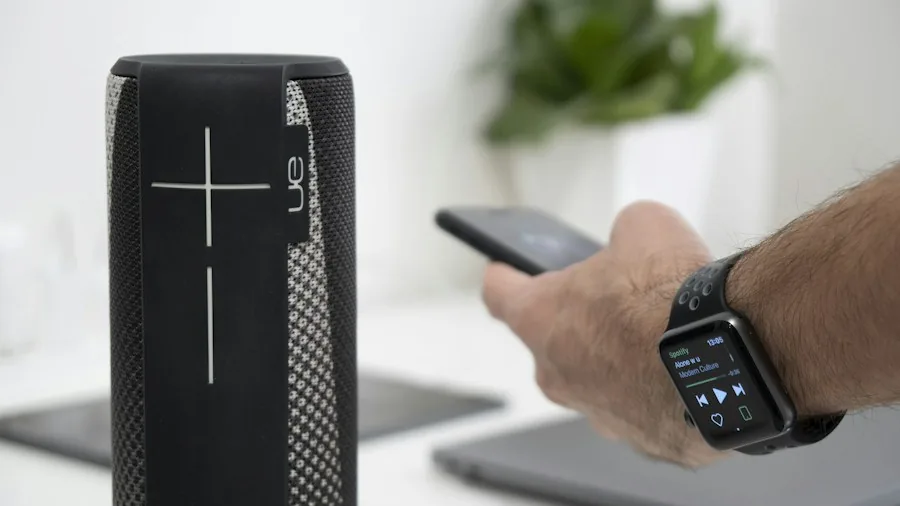 person using voice command smart speaker