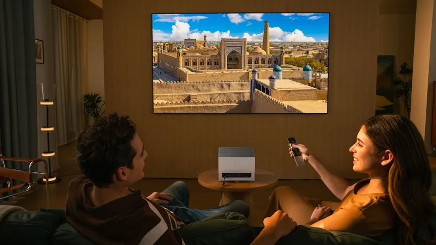 Person watching movie in dark home theater room with projected image on screen