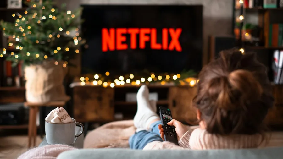 person watching TV relaxed couch