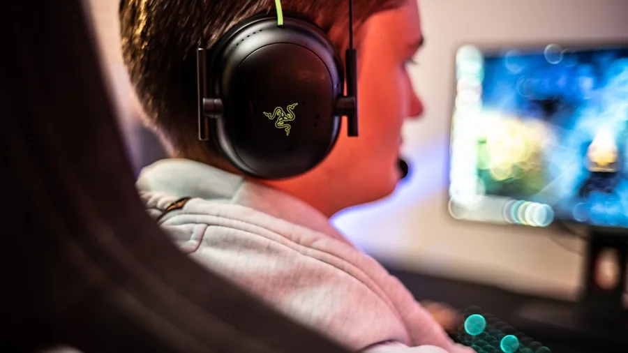Person wearing comfortable headphones during long gaming session at desk setup