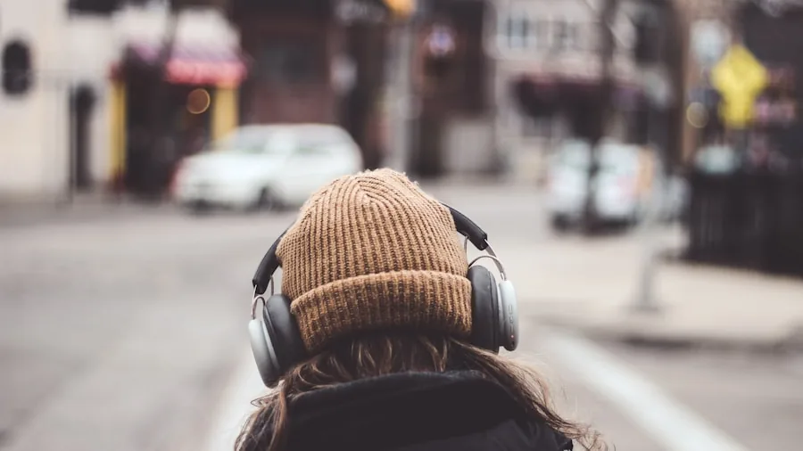 Person wearing earbuds during daily commute, experiencing audio quality in real-world environment