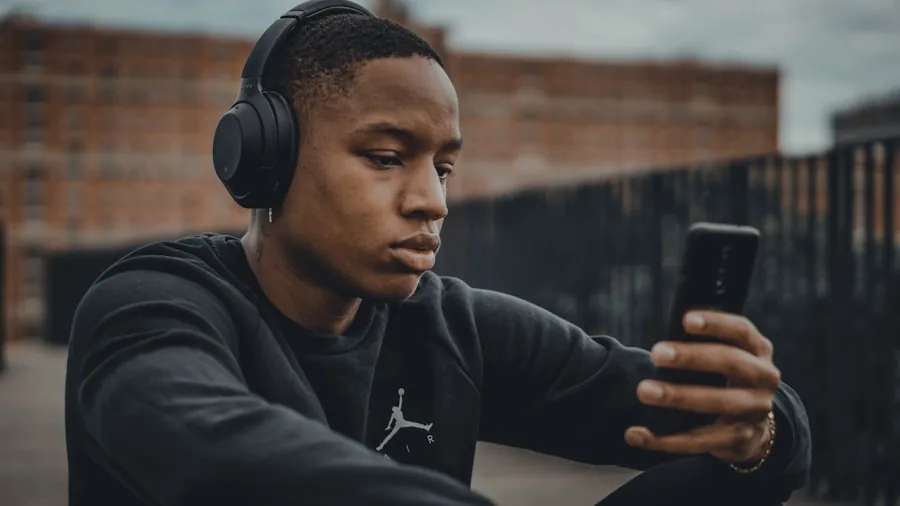 Person wearing earbuds outdoors enjoying high-quality audio in natural light