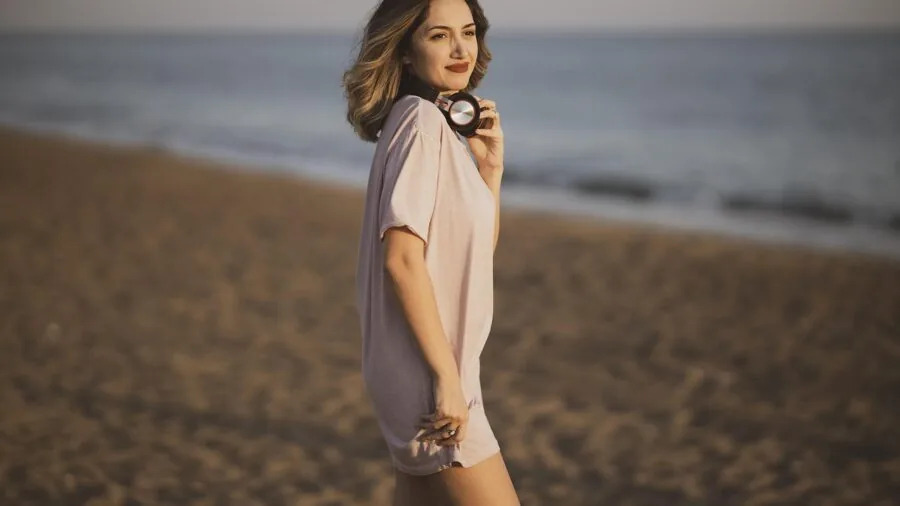 Person wearing headphones enjoying music in a natural setting