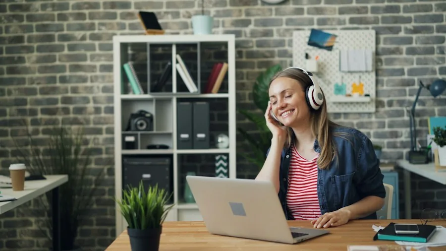 person wearing headphones workspace