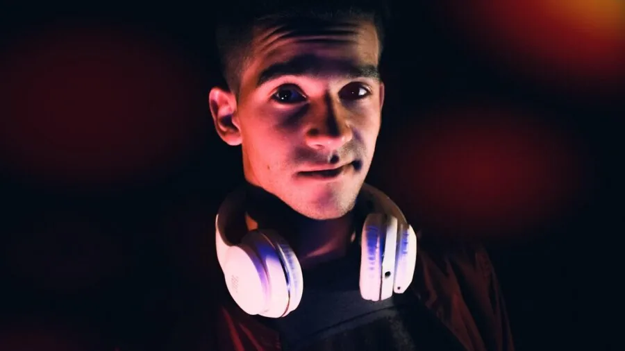 Person wearing over-ear headphones on public transportation, experiencing comfort and noise isolation in daily life