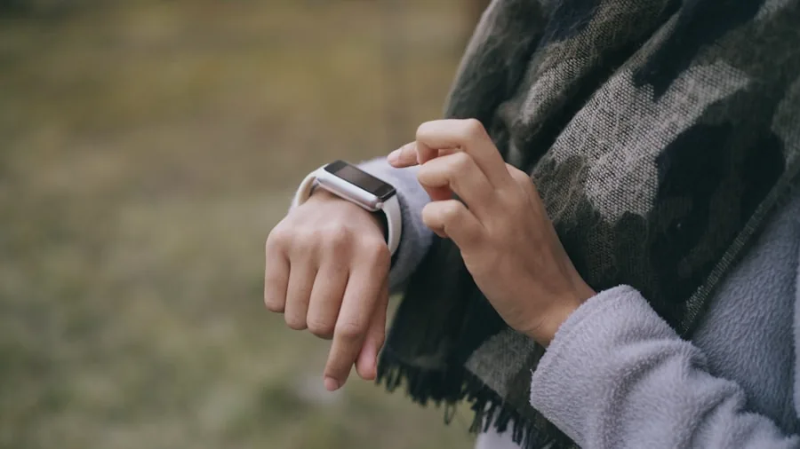 Person wearing smartwatch checking time outdoors in natural daylight