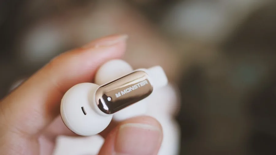 person wearing white earbuds modern gadget