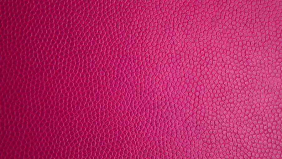 Person wiping down gaming chair upholstery with cloth, demonstrating easy maintenance of PU leather material