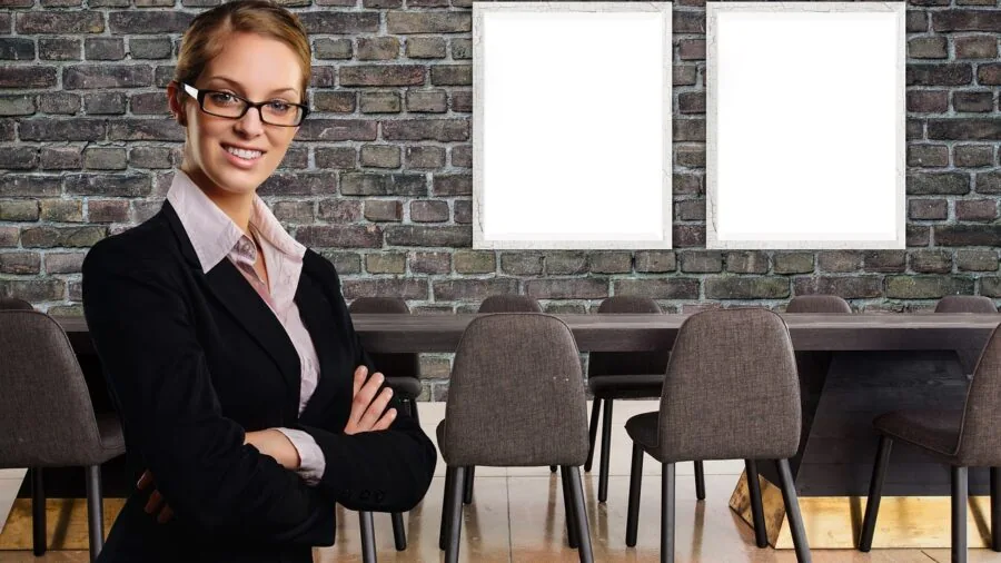 Person working at desk with computer equipment and backup power system visible in home office environment