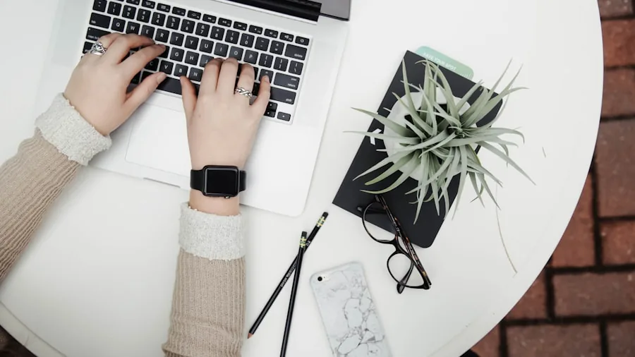 Person working on laptop at desk for everyday computing tasks