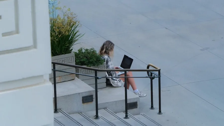 Person working on laptop outdoors in a calm, natural setting with good lighting