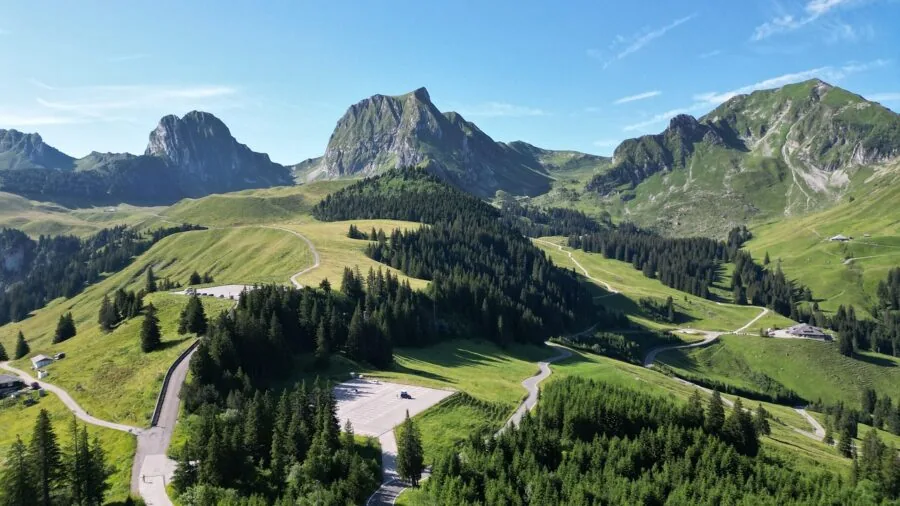 Photographer composing aerial landscape shot with natural lighting and detailed scenery