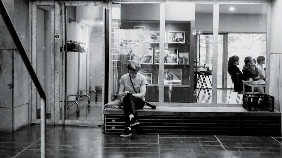 Photographer struggling with low light conditions indoors, demonstrating camera sensor limitations in dim environments