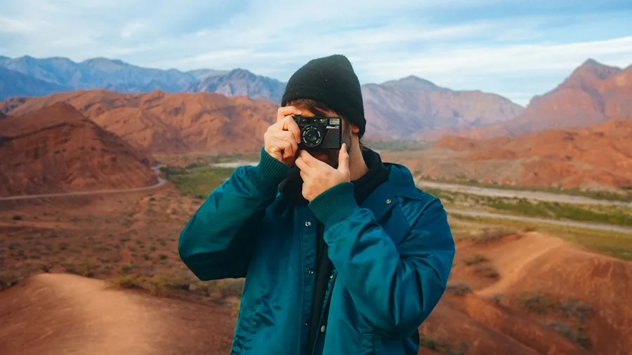 photographer working with compact camera outdoors