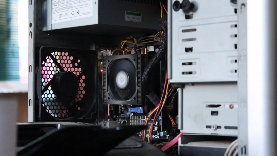 Professional focused on computer work at desk with intense concentration