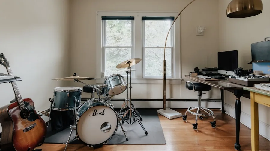 Professional musician working with audio cables and equipment in a home studio setup