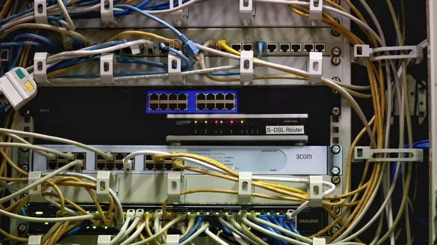 Professional network setup with organized cables and equipment in a modern data center environment