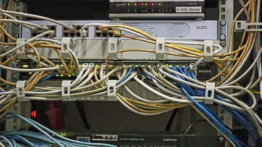 Professional organizing multiple cables and ports on desk workspace