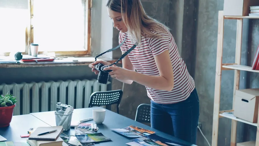 Professional photographer reviewing color-accurate images at desk with natural lighting