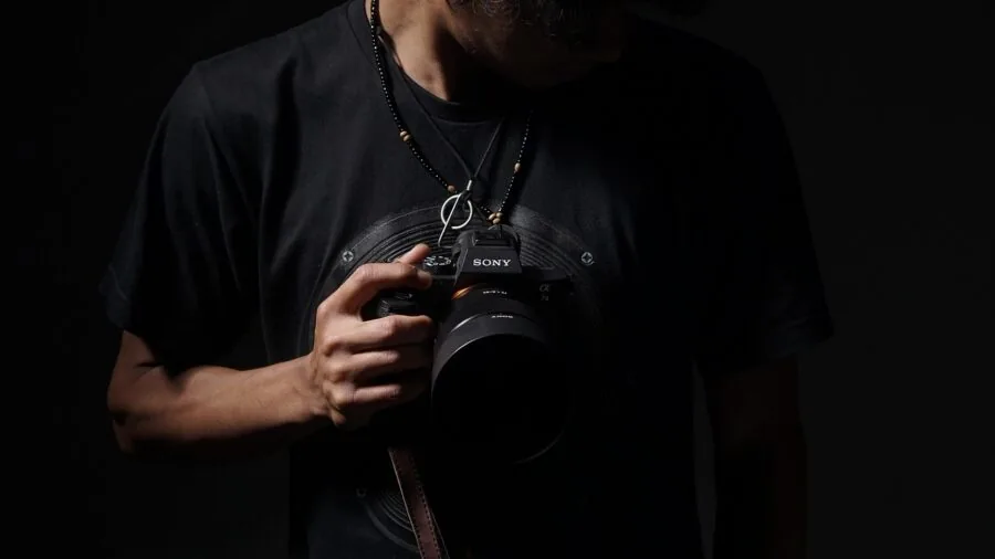 Professional presenting to camera with focused framing and minimal background distractions