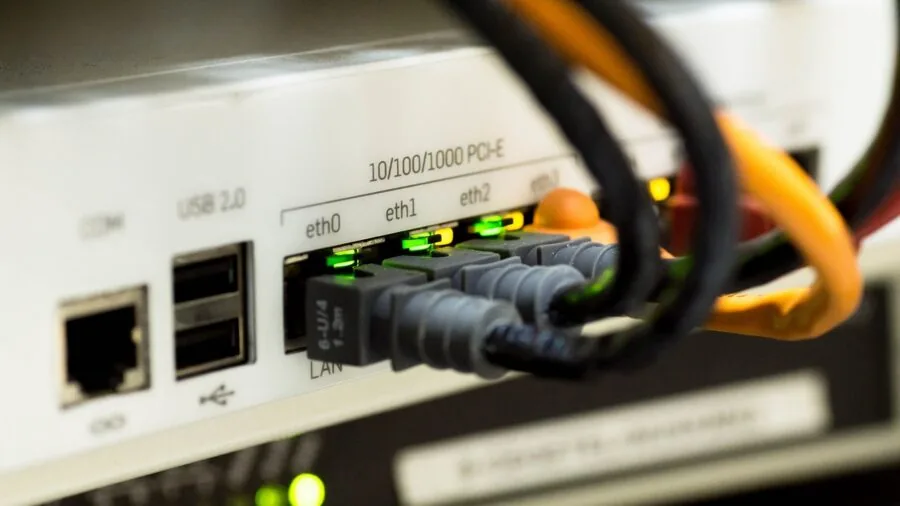 Professional setting with ethernet cables and network infrastructure equipment in modern workplace environment