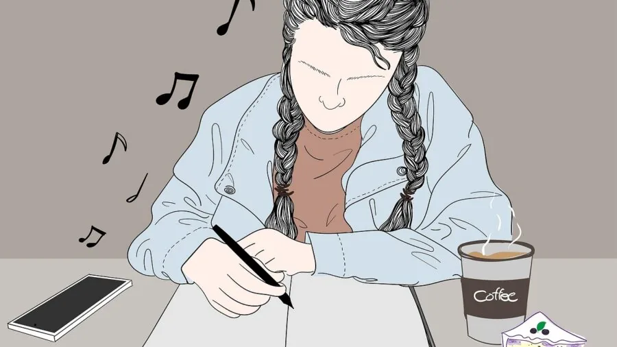 Professional wearing headphones at desk during work session, appearing comfortable and concentrated