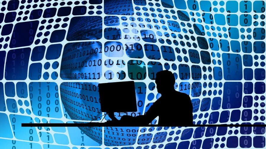 Professional working at desktop computer setup in modern office environment