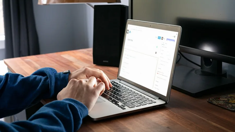 Professional working at organized desk with keyboard and monitor in home office environment