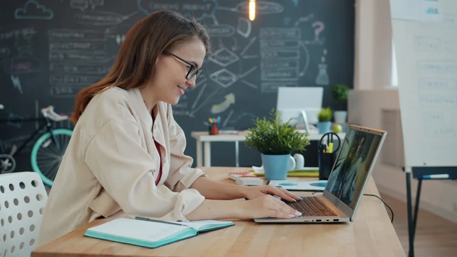 Professional working from home during a video conference call on laptop in modern office space
