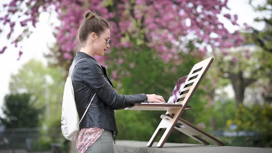 professional working on thin laptop outdoors