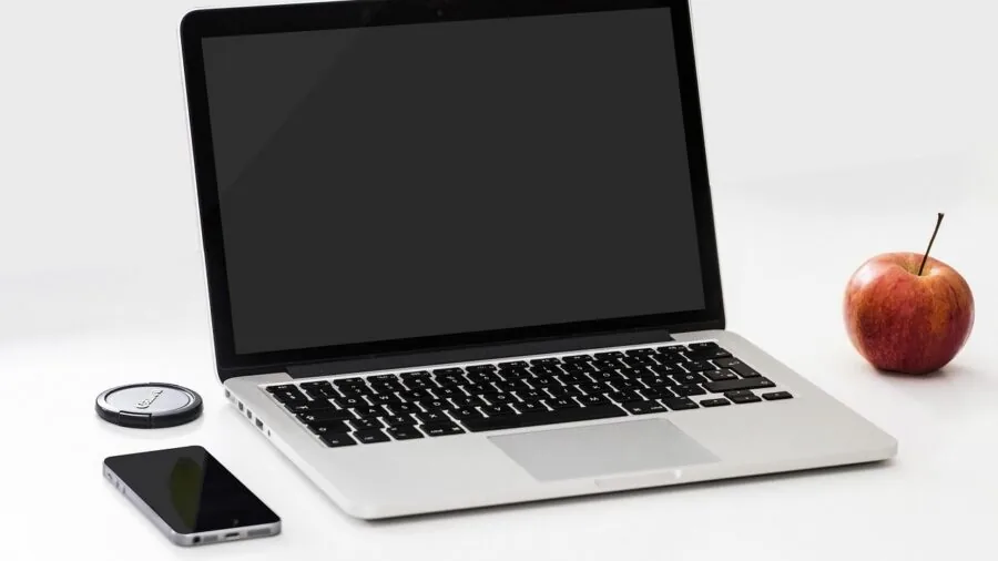 Professional working remotely on lightweight portable setup while traveling, emphasizing mobility and convenience