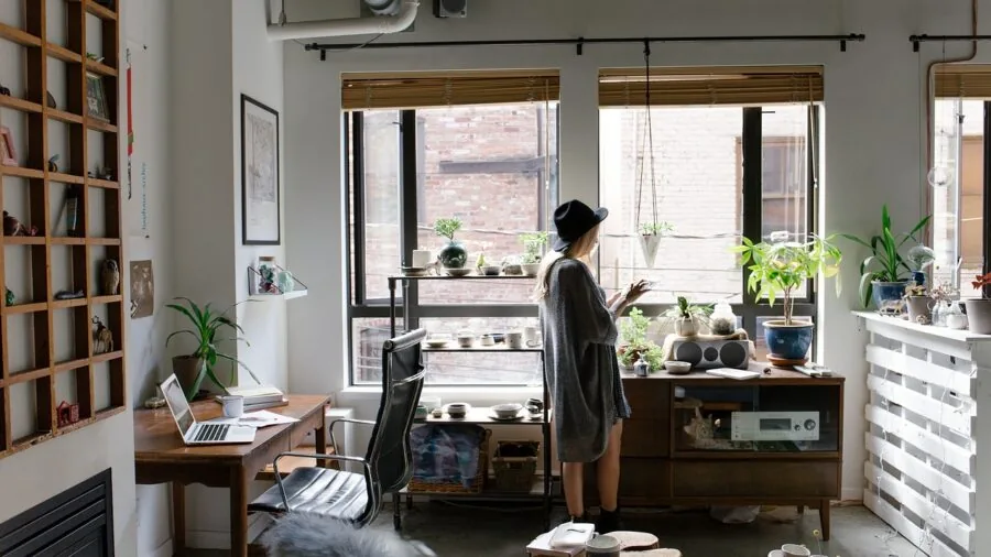 Professional workspace with laptop, external devices, and cables organized on desk for productive work setup