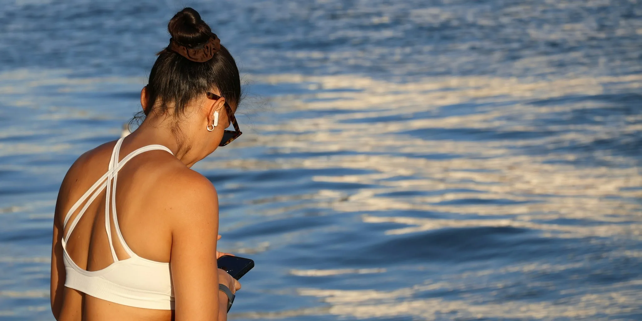smartphone user checking phone outdoors