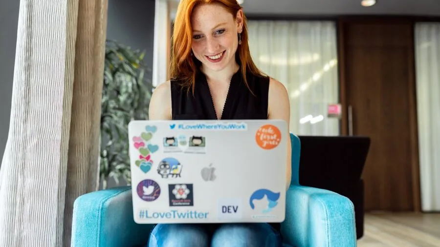 Software developer working at computer setup in office environment, representing technology management and digital solutions