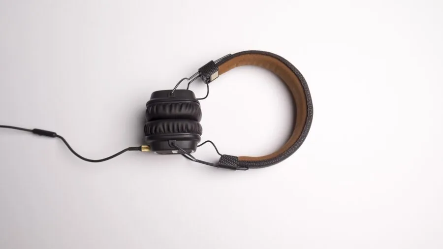 Someone enjoying audio in a home studio environment with professional listening setup