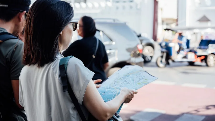 traveler looking at map while speaking with locals