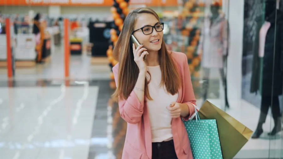 young adult shopping for new mobile phone