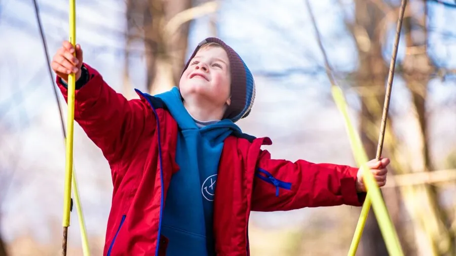 Young child enjoying outdoor play and movement in natural daylight setting