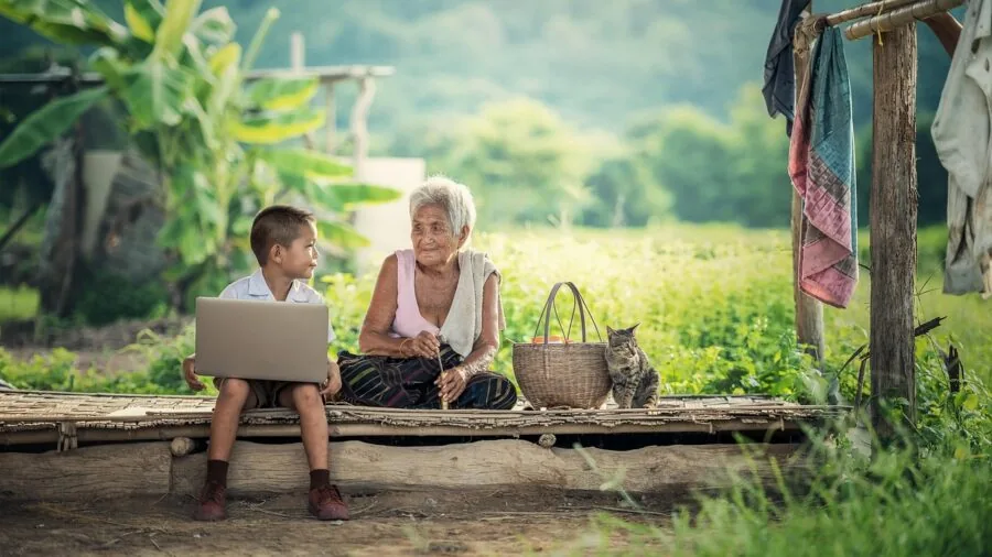 Young child exploring smartphone features with focused attention in natural home setting