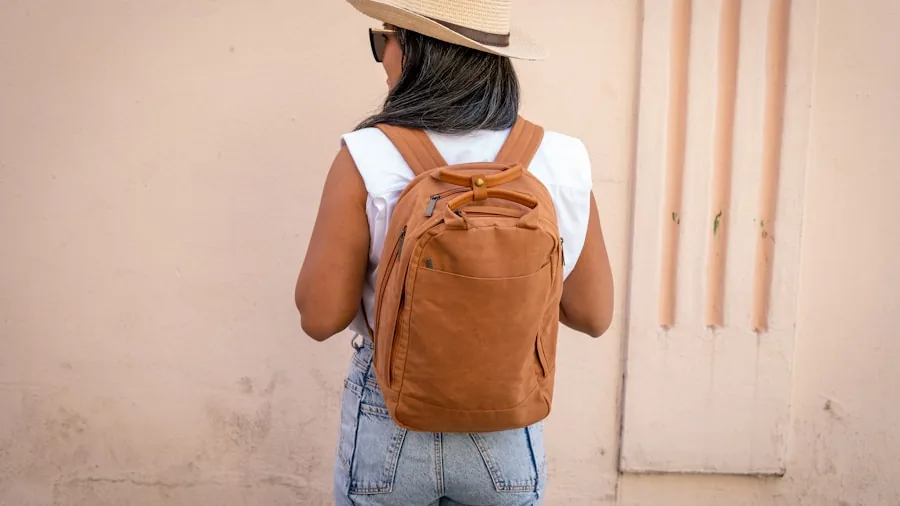 Young professional with backpack commuting through urban environment, emphasizing portability and mobility